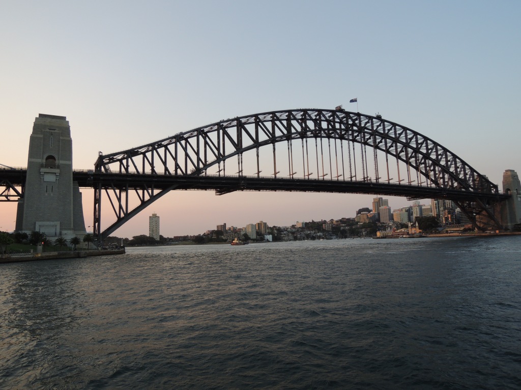 Sydney Harbour Bridge in the twilight, with a greying sky.